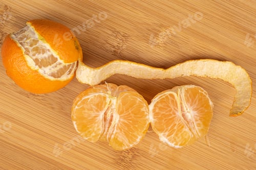 Preview: Group Of One Whole Two Halves Of Fresh Orange Mandarin Flatlay On Light Wood