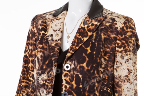 Preview: Mannequin In Leopard Blazer. Necklace In Form Of Key. Pattern On High Quality Fabric. Add Charm To