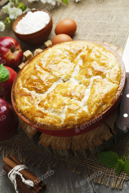 Preview: Pie And Red Apples On A Wooden Table