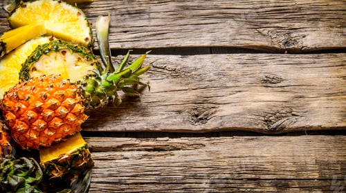 Preview: Fresh Sliced Pineapple With Whole. On The Wooden Background. Free Space For Text .