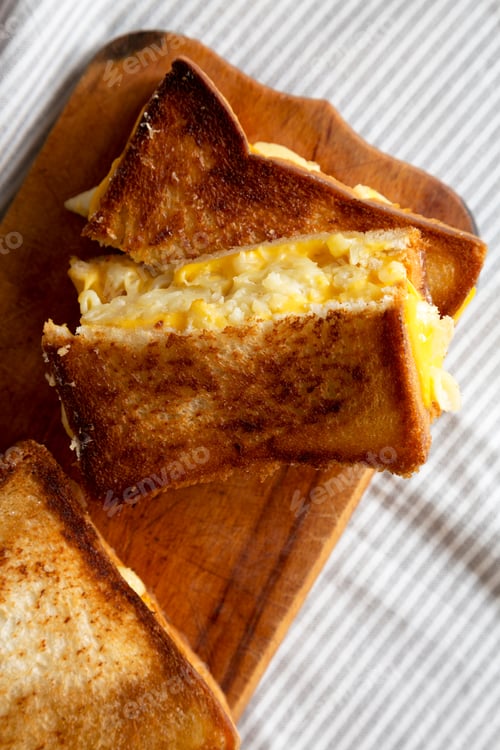 Preview: Homemade Grilled Macaroni And Cheese Sandwich On A Rustic Wooden Board, Overhead View. Flat Lay