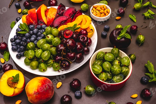 Preview: Assorted Fresh Fruits On A Plate. Ripe Berries Of A Cherry, Gooseberry, Blueberries, Slices Of