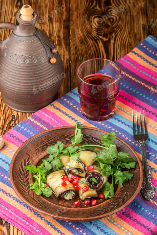 Preview: Rolls Of Fried Eggplant With Cheese, Garlic, Cilantro And Pomegranate Seeds. Gourmet Appetizer