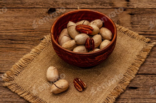 Preview: Ripe Pecan On Vintage Wooden Background. Traditional Ingredient For Pecan Pie In Usa