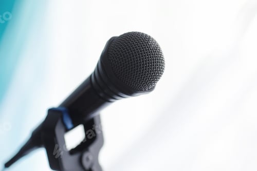 Preview: Stand With A Microphone. Man Holds Hands A Microphone On Tripod. Performance Of The Artist With A