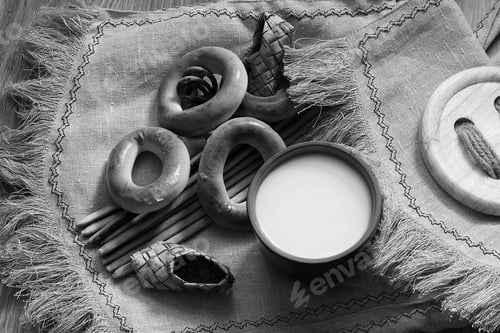 Preview: Food Milk In A Glass Straw Bagels And Pretzels On Flax Background