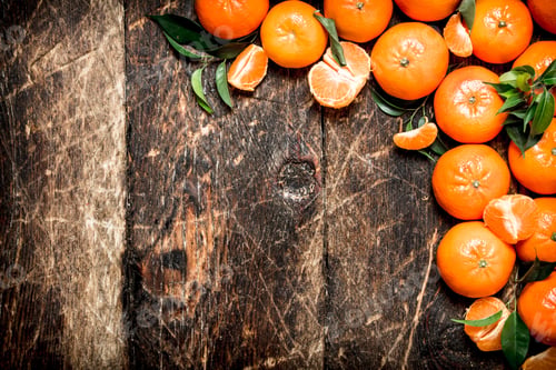 Preview: Fresh Tangerines With Green Leaves. On Wooden Background.