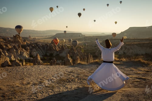 Preview: Dervish Doing The Retual In Love Valley Of Cappadocia With Balloons In Background At Sunrise.