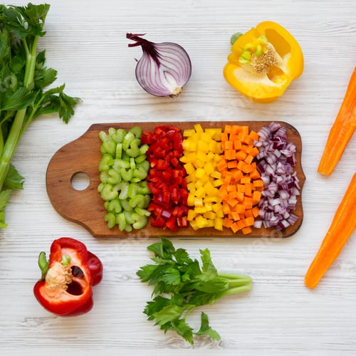 Preview: Chopped Vegetables (Carrot, Celery, Red Onion, Peppers) Arranged On Cutting Board On A White Wooden