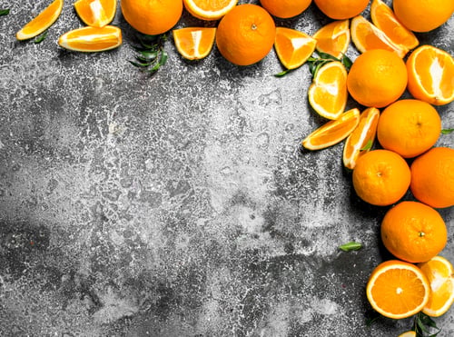 Preview: Fresh Oranges With Leaves. On A Rustic Background.