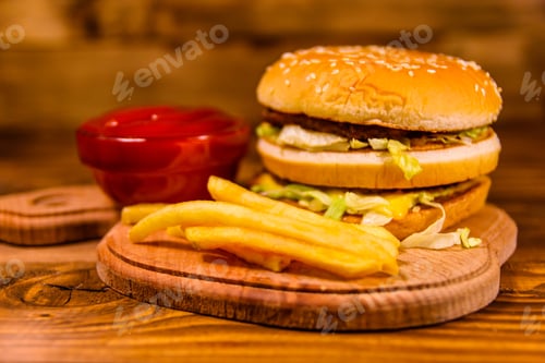 Preview: Hamburger And Sauce On Rustic Wooden Table