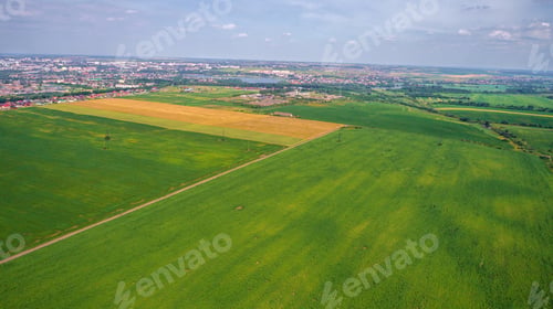 Preview: Drone With A Camera On A Green Field.