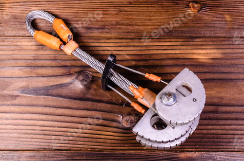 Preview: Camming Device Friend For Rock Climbing On Rustic Wooden Table. Top View