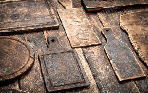 Preview: Serving Background. Different Old Cutting Board. On A Wooden Table.