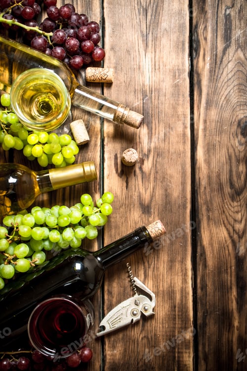 Preview: White And Red Wine With Branches Of Grapes , A Corkscrew And Corks. On A Wooden Table.