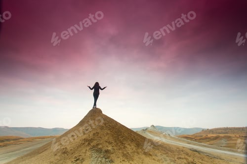 Preview: Silhouette Of Woman Meditating On Top Of A Hill
