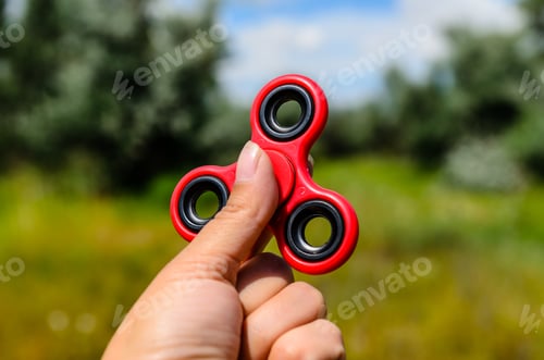 Preview: Red Fidget Spinner In A Female Hand