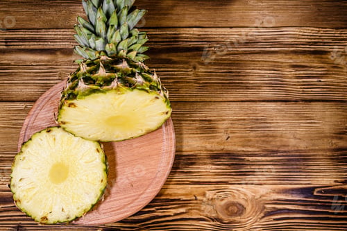 Preview: Cutting Board With Sliced Pineapple On Rustic Wooden Table. Top View