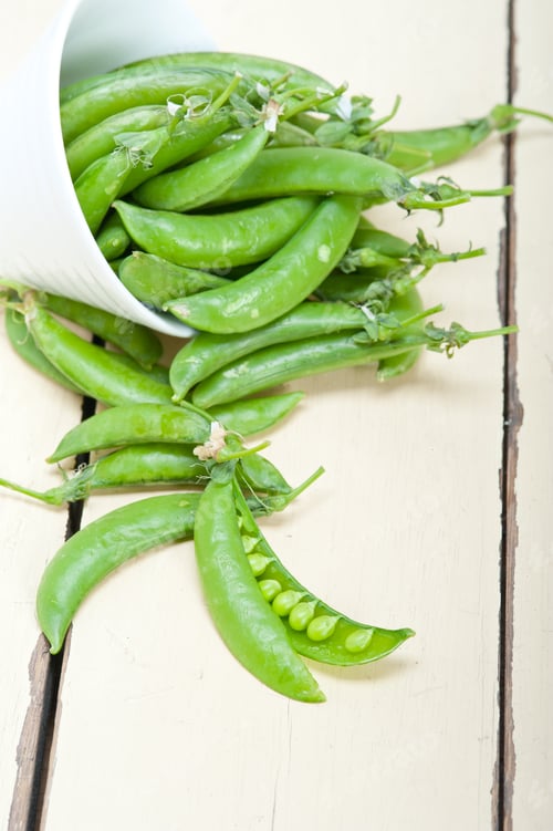 Preview: Hearthy Fresh Green Peas Over A Rustic Wood Table