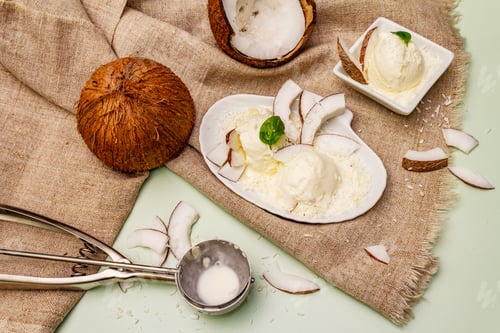 Preview: Lactose Free Coconut Ice Cream. Special Spoon, Halves Of Fruit, Flakes. Vegan Dessert Concept