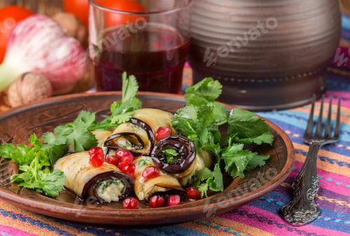 Preview: Rolls Of Fried Eggplant With Cheese, Garlic, Cilantro And Pomegranate Seeds. Gourmet Appetizer