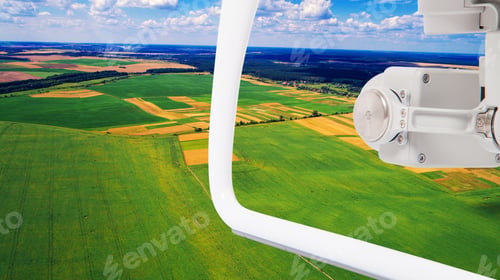 Preview: Drone With A Camera On A Green Field.