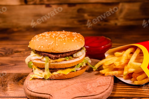 Preview: Hamburger And French Fries On Rustic Wooden Table
