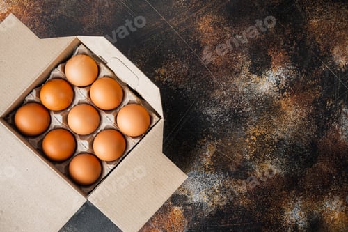 Preview: Brown Eggs In Carton Box Tray, On Old Dark Rustic Background, Top View Flat Lay , With Space For