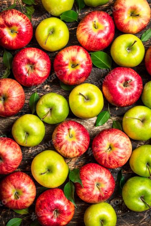 Preview: Red And Green Apples . On Wooden Background.