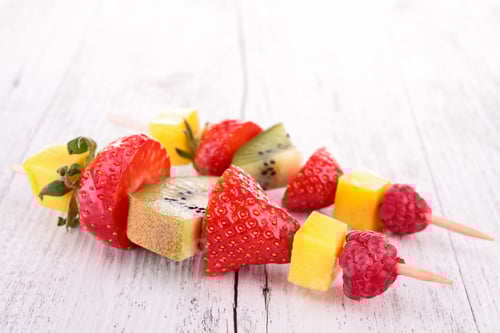 Preview: Delicious Fruit Skewers on a White Wood Table