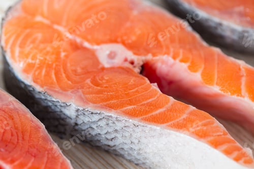Preview: Freshly Cut Raw Salmon With Spices On Wooden Surface