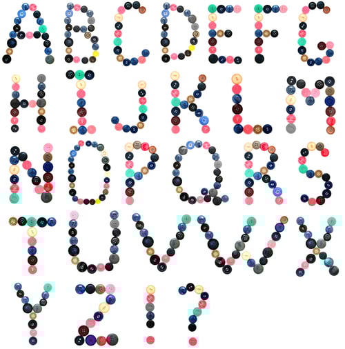 Preview: The Alphabet From Buttons For Sewing. On A White Background.