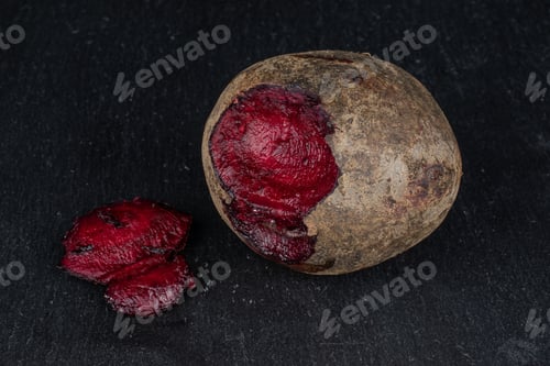 Preview: Group Of One Whole One Piece Of Raw Sweet Beetroot On Grey Stone