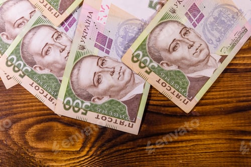 Preview: Ukrainian Five Hundred Hryvnas Banknotes On Rustic Wooden Table