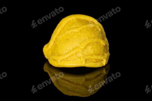 Preview: One Whole Colorful Pasta Orecchiette Isolated On Black Glass