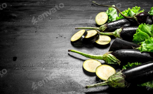 Preview: Fresh Eggplant And Sliced Pieces. On The Black Chalkboard.
