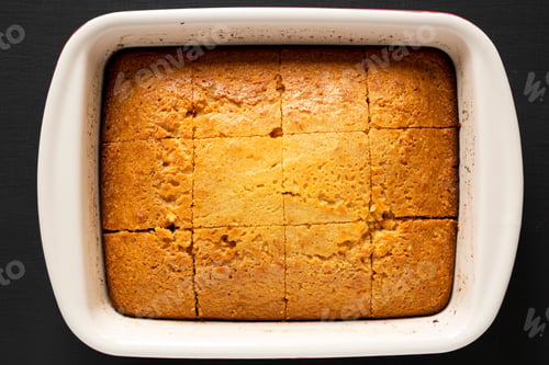 Preview: Homemade Sweet Cornbread Ready To Eat On A Black Background, Top View. Flat Lay, Overhead, From