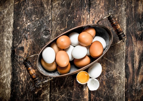 Preview: Fresh Eggs In A Bowl. On A Wooden Background.