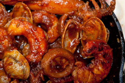 Preview: Fresh Seafood Stew Prepared On An Iron Skillet Ove White Rustic Wood Table