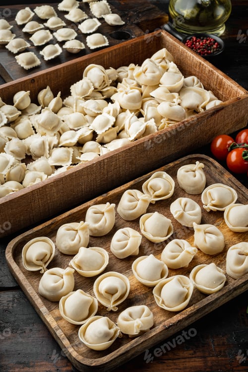 Preview: Raw Italian Ravioli Tortellini With Fresh Parmesan And Basil , Tomatoes Set On Old Dark Wooden