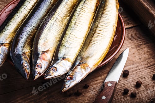 Preview: Appetizing Smoked Fish On Kitchen Board.Smoked Saury.Smoked Fish With Spices