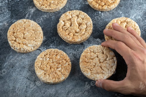 Preview: Male Hands Holding Crispbread On Marble Background