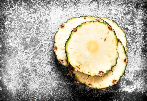Preview: Fresh Pineapple Chunks. On The Rustic Background.