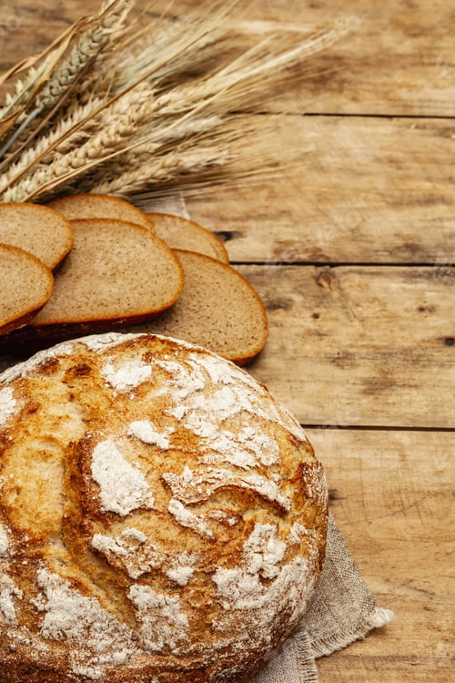Preview: Fresh Baked Bread With Wheat Ears And Slices. Vintage Wooden Boards Table, Kneading The Dough, Top