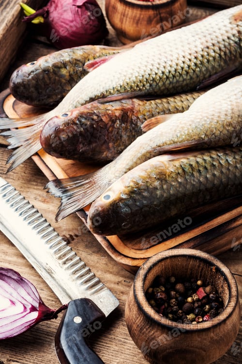 Preview: Fresh Raw Fish On Wooden Cutting Board.Raw Fish With Spices For Cooking