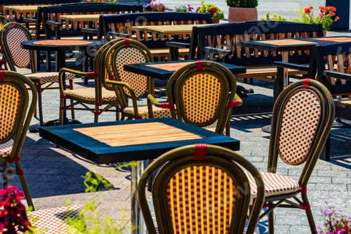 Preview: Chairs And Tables In Cozy Street Cafe