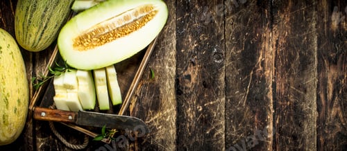Preview: Sliced Pieces Of Ripe Melon On An Old Tray. On A Wooden Background.