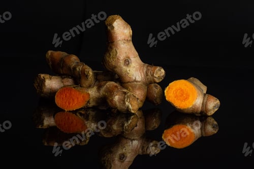 Preview: Group Of Lot Of Whole One Half One Slice Of Bright Turmeric Rhizome Isolated On Black Glass