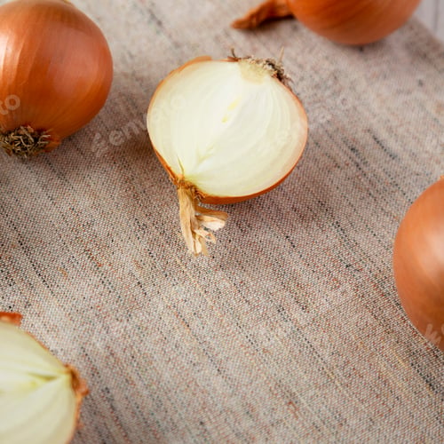 Preview: Unpeeled Raw Golden Onions On Cloth, Low Angle View. Close-Up.