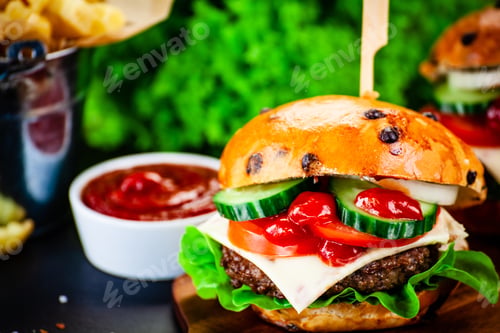 Preview: Tasty Burgers With Chips Served On Cutting Board